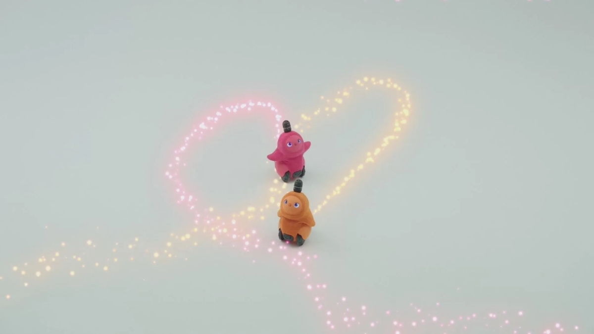 二匹のLOVOTがハートの光の中にいる可愛らしい画像