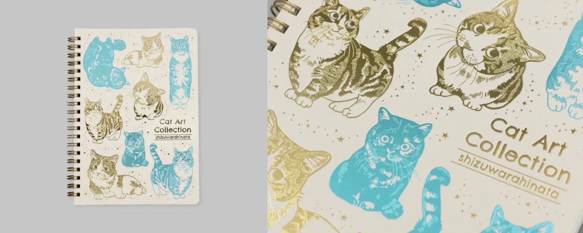 金色の猫と水色の猫がデザインされたノート
