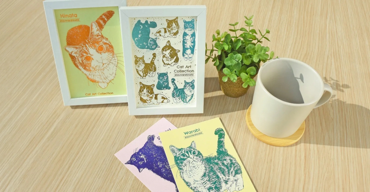 猫のイラストが描かれたフレームやカード