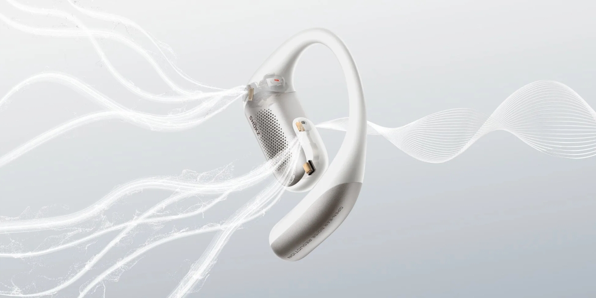 白とグレーのイヤホンと抽象的な白い線が描かれた画像。